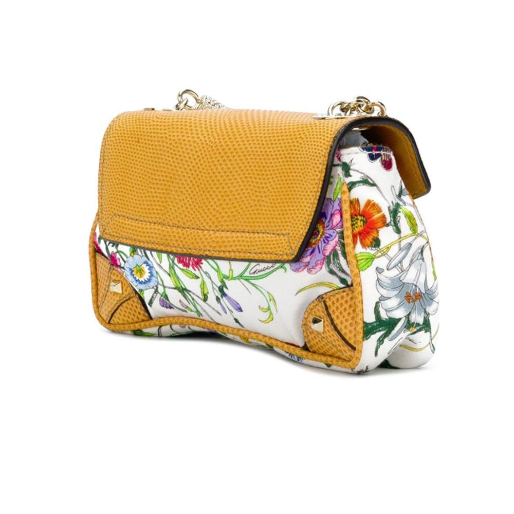 So cute and collector !!! Mini Gucci leather and silk blend embellished featuring a top handle and a main internal compartment. Crystal bamboo clasp. 

New condition with dustbag 

Depth:3 cm
Handle:12 cm
Width:15 cm
Height:	9 cm

Collector, we love