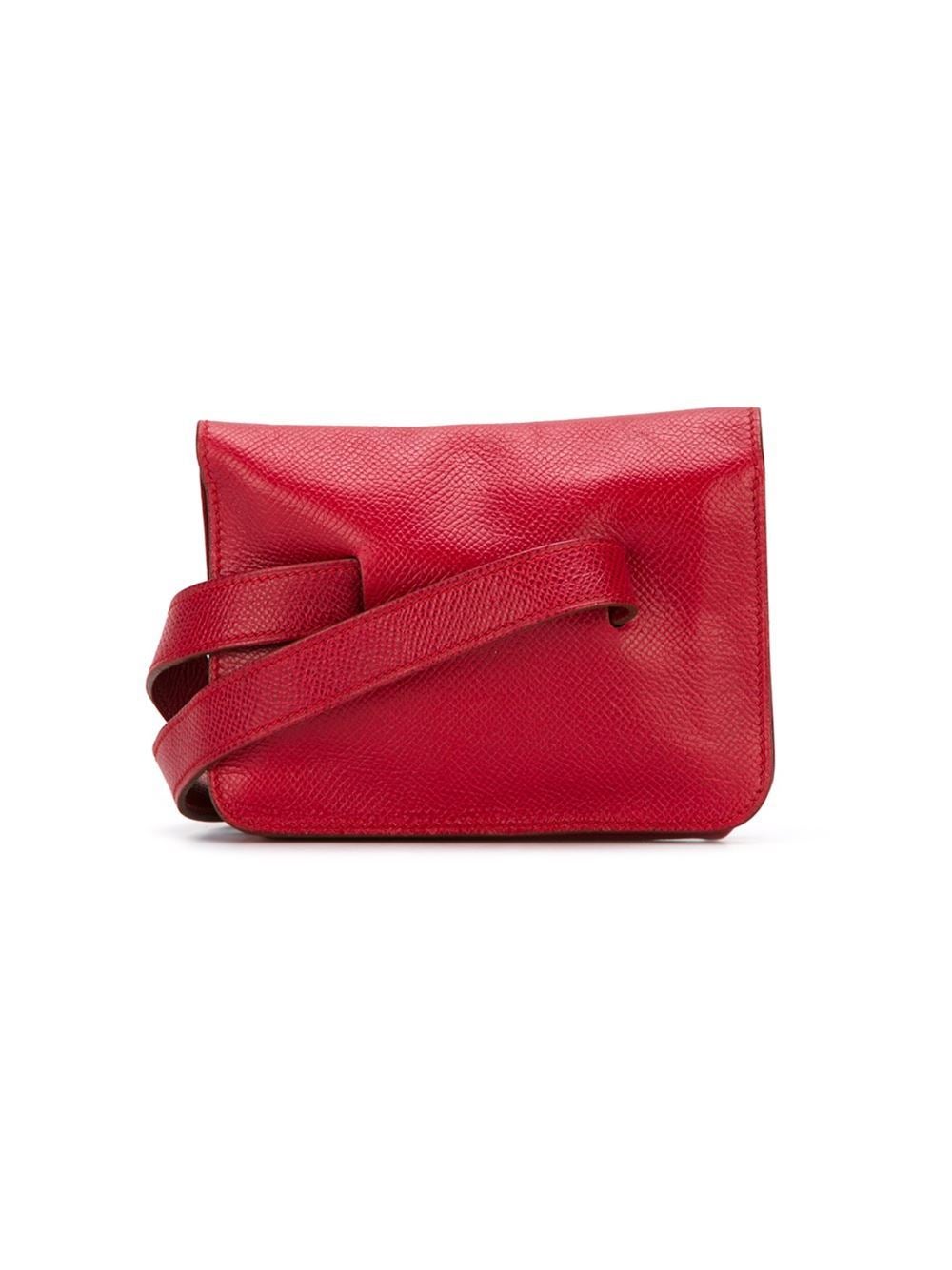 Super cute Hermes waist pouch in red epsom leather, front flap closure and press stud fastening. Excellent vintage condition. W: 14cm H: 11.5cm D: 3.5cm. Marked Hermès Paris. Letter U in a circle. 1991.
