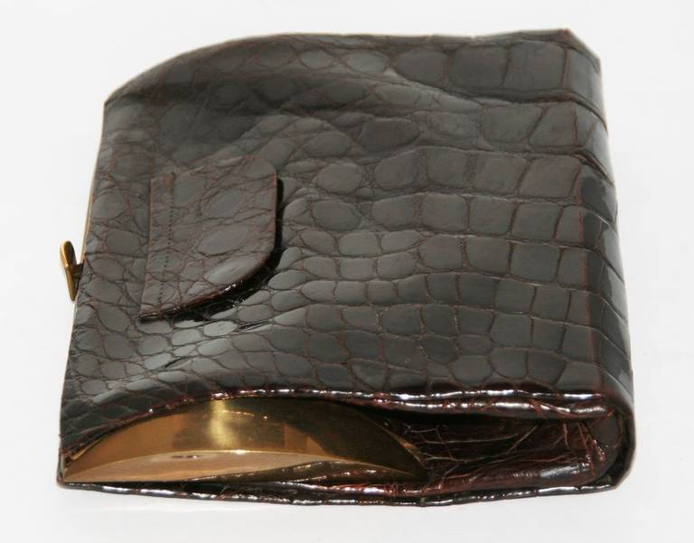 Unique Very Stylish Art Deco Vintage Crocodile Clutch, brown color. Gold hardware finishing.  Synthetic brown Lining. Very good vintage condition. Size : 20 x 17 x 4.5 cm – 7.9 x 6.7 x 1.8 in.