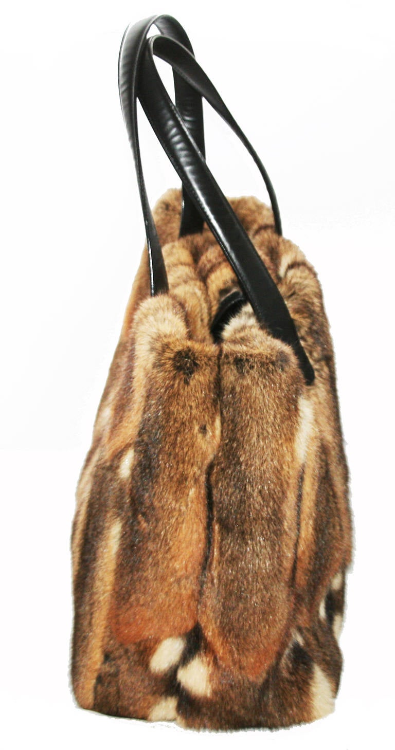 One-of-a-kind Vintage Chanel Fur bag in Excellent condition. Very unique & perfect for the Winter ski Holidays! Mat silver plated hardware. Black leather handles and finishing. Rabbit fur. Marked : Chanel Made in France. With Orginal Dustbag. 
Size