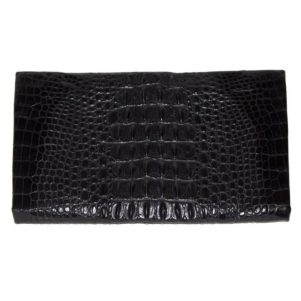 A wide and very elegant black crocodile clutch of the 40s, suede lining. Very good vintage condition. Size : 29 x 17.5 cm - 11.4 x 6.9 in. 