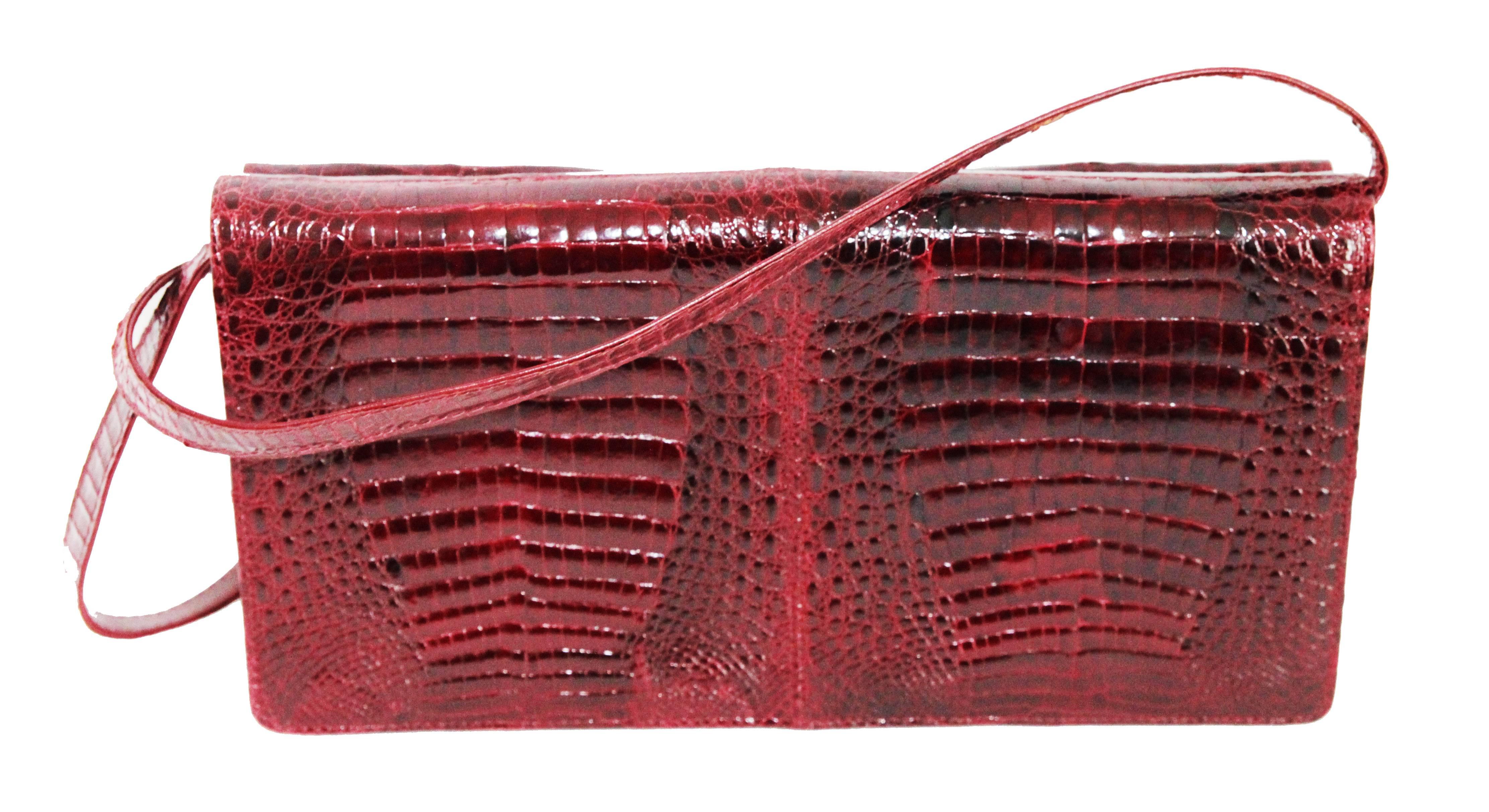 Very stylish Italian baby crocodile leather clutch/handbag. Rare and beautiful quality. c.1970. Gold plated metal finishing. Marked API, Italy. Excellent vintage condition. Size: 29 x 16 x 5 cm. 11.4 x 6.3 x 2 in.
International Shipping - All
