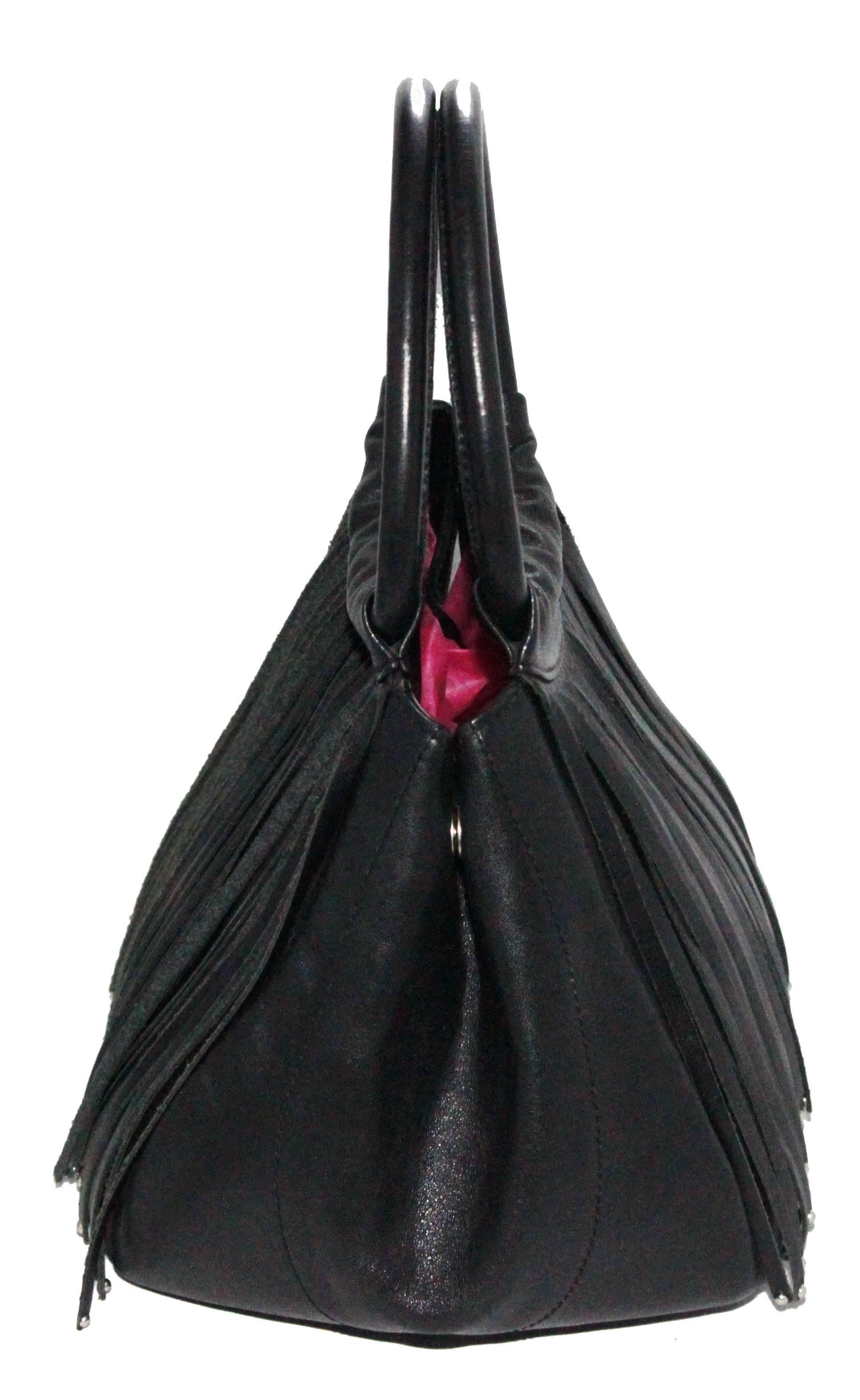 Fringes? Yes, but vintage! Look at this unusual Charles Jourdan black fringes handbag of the early 90s. Made of calf leather & fabric lining. 

Size: 24.5 x 19.5 x 17.5 cm

Marked: Charles Jourdan 

Excellent condition. 