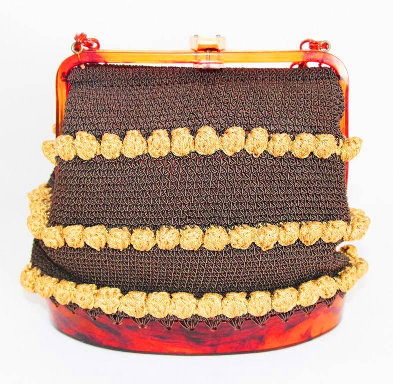 Unique and gorgeous 50s brown and gold passementerie evening bag. A real beauty and so unique. Amber lucite in excellent condition. 

Size : 19 x 21 x 9 cm - 7.5 x 8.3 x 3.5 in.
