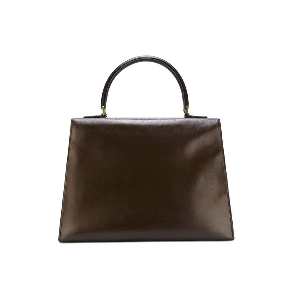 The Saint Tropez Hermès vintage bag. A rarity of 1967. Made of brown leather and gilt metal. The design of this bag is a real beauty. Rare to find, collectable. 

Marked : Hermès Paris Made in France

Size : 24 x 33 x 12 cm - 9.5 x 13 x 4.7