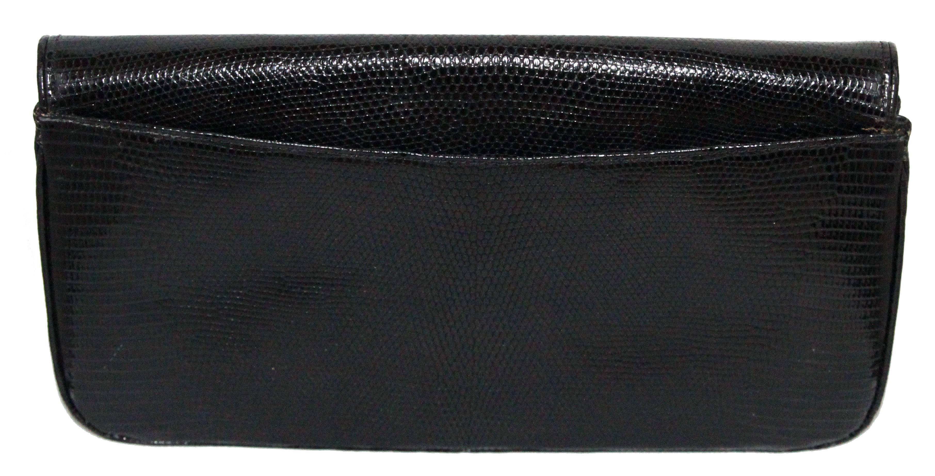 Exceptional large Gucci black lizard clutch of the 80s. Perfect style and collectable. Gorgeous lizard quality. Black leather lining. No shoulder strap. 

Marked : Gucci

Size : 32 x 17 x 4 cm - 12.6 x 6.7 x 1.6 in.  

Excellent vintage