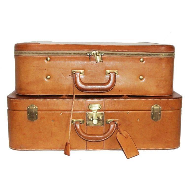 Two Great Hermès suitcases. Made of leather and canvas. c.1960. Nice to travel or just to look at! The french elegance and savoir-faire. 

Marked : Hermès Paris 

Size : Leather suitcase : 60 x 40 x 18 cm - 23.6 x 15.8 x 7.1 in.

Canvas suitcase :