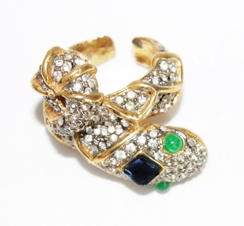 Rare and Gorgeous KJL snake crystal ring. Made of crystal stones, green & black glass cabochons. Gilt metal. 

Marked : KJL

Size : French size : 54 - US : 7

Excellent condition. 