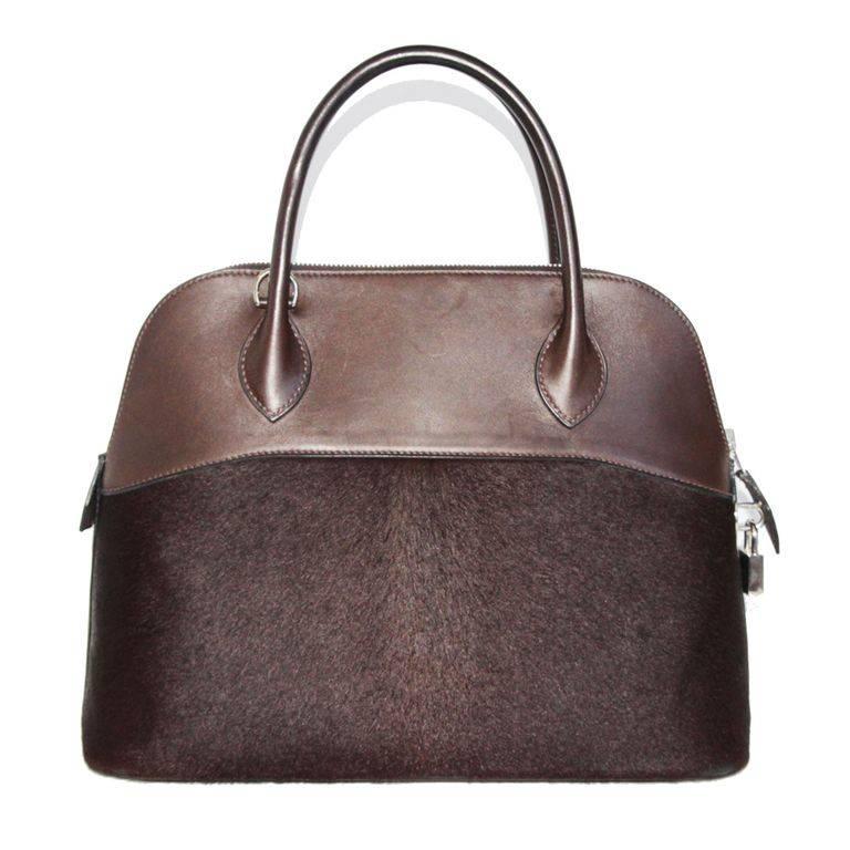 Rare and collectable Hermès Bolide, special edition. Pony hair and brown leather. Silver hardware finishing. 

Marked: Hermès Made in France. 

Size: 33 x 24 x 13 cm

Excellent vintage condition.