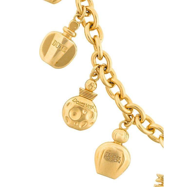 Fun Christian Dior charms poison perfume bracelet of the 90s. Made of gilt metal. 

Marked : Tendre Poison, Christian Dior

Size : circumference : 19.1 cm - 7.5 in.

Very good condition.  