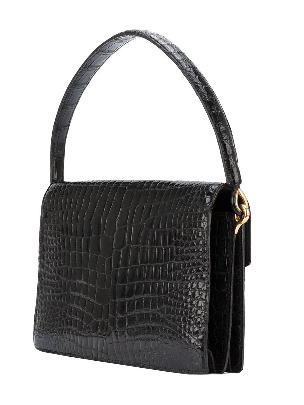 A timeless must-have, the perfect french elegance!!! Divine quality of black crocodile leather. Magnificent Hermes black crocodile leather bag of the 60s. The 'Cordeau' model. Excellent condition. Exceptional black crocodile leather. gold hardware