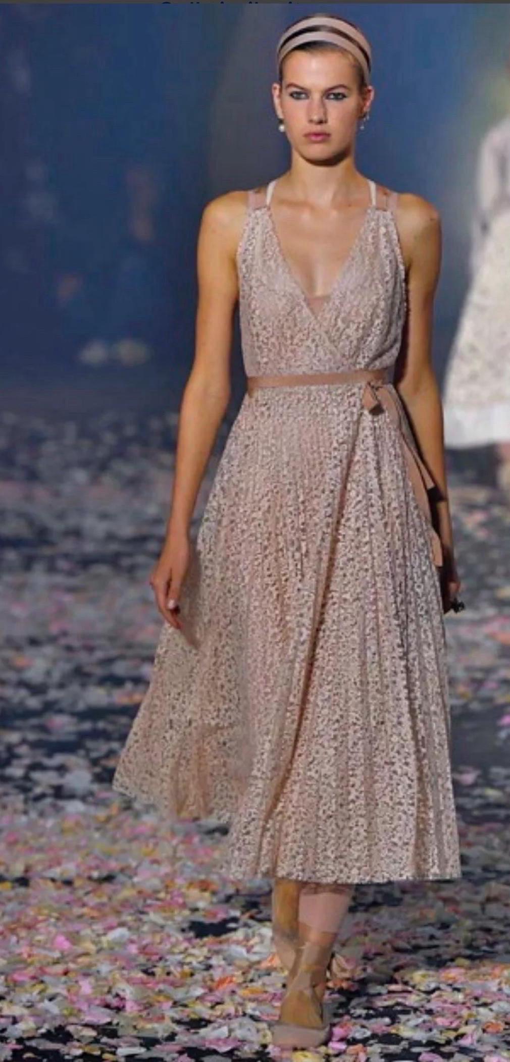 An exquisite runway dress from Christian Dior’s Spring/Summer 2019 collection, designed by Maria Grazia Chiuri. This look—number 64 on the Paris runway—captures the ethereal femininity and balletic grace that defined the season.

• Blush pink floral