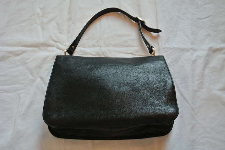 Black leather GUCCI classic black leather handbag with gold interlocking G's.