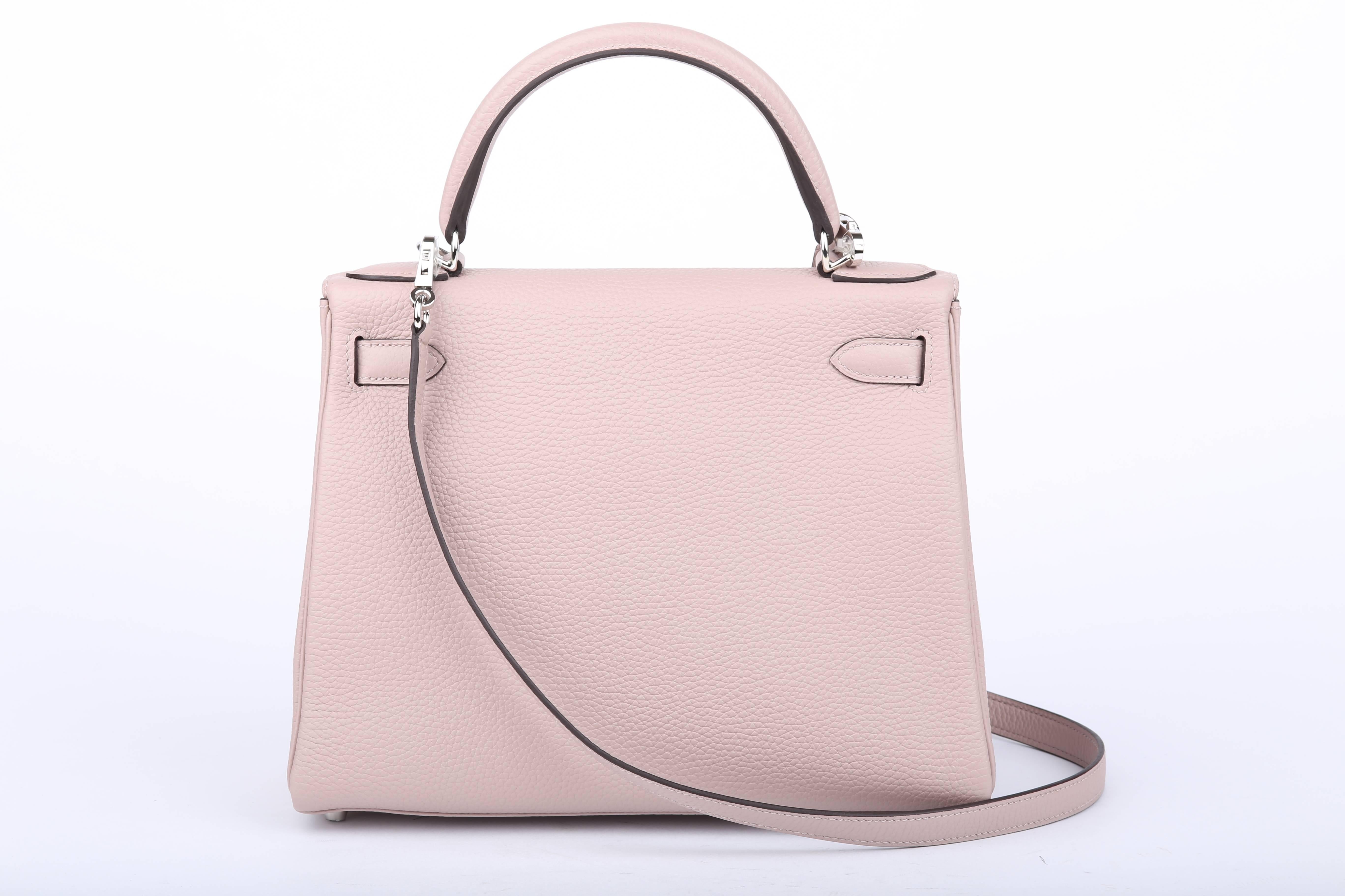 Hermes Kelly cute 28 cm with the New Glycine Color is a muted dusty lilac - yet very neutral ! 

This bag comes with all its details attached -  lock, keys, clochette, a fabric sleeper for the bag, rain protector and BOX! 

The item has original