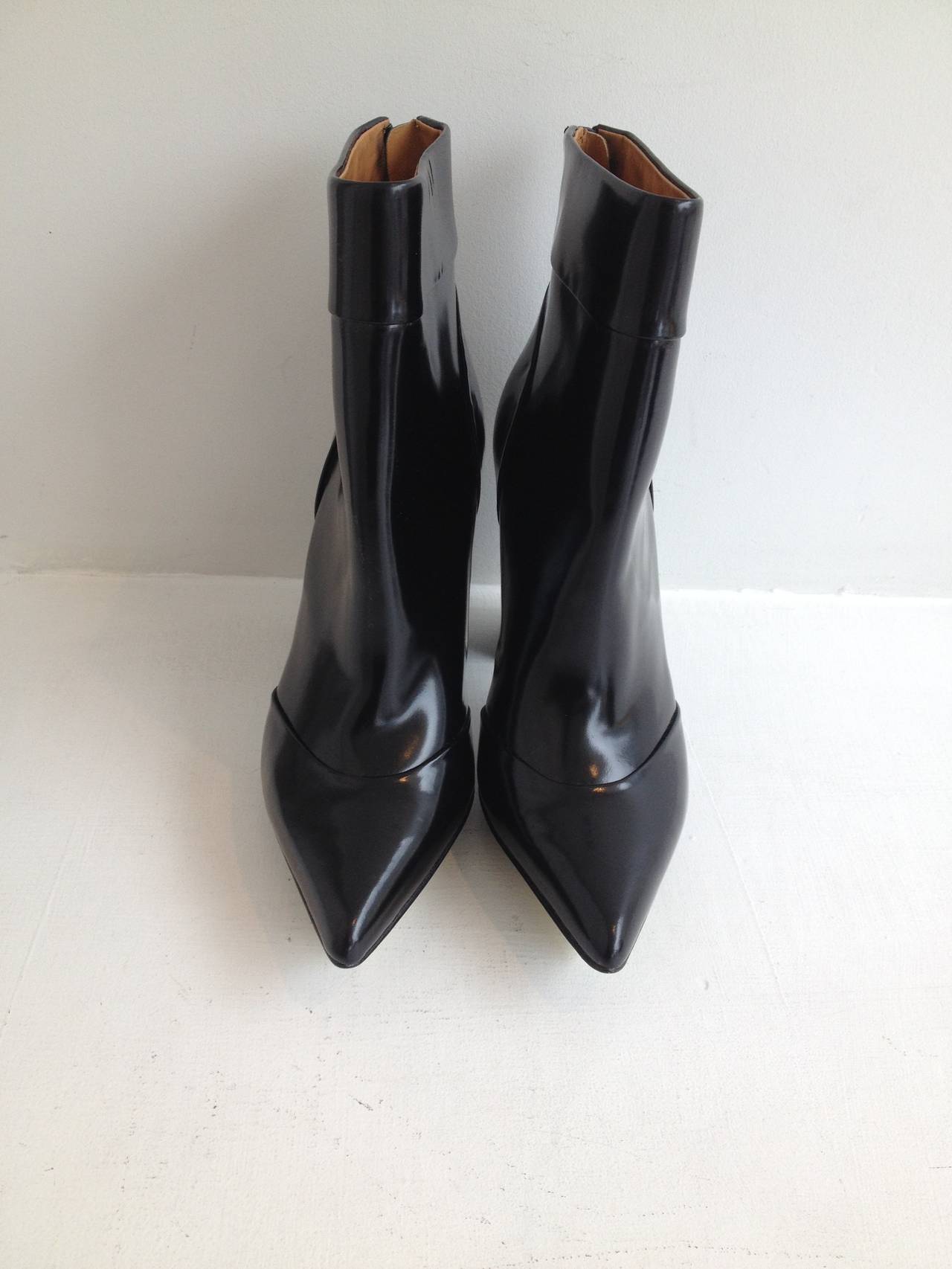 So sleek! These 3.1 Phillip Lim ankle boots are perfect because of how subtle they are - they blend into any outfit but quietly make the whole look more chic. The 4.125 inch heels elongate your silhouette, while the slim and clean shape of the boot