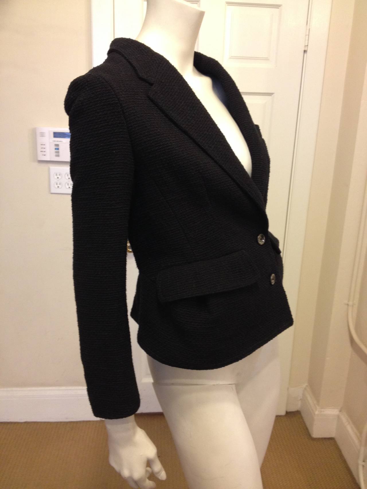 The perfect black blazer for interviews to dinners out, for special events to meetings - you'll always look chic in this piece. The material is a warm wool/cotton fabric but the cut is sleek and tailored in all the right ways. The neckline dips into