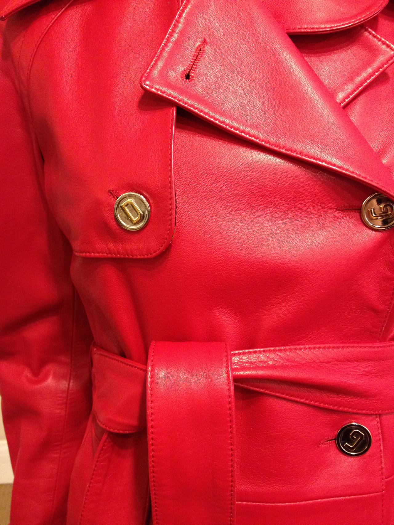 With classic gold Dolce & Gabbana buttons, this coat, in the softest red leather, is fabulous, worldly and fun. It is the perfect piece for a woman on the go that doesn't  mind to stand out. Toss this piece on with anything from wide-leg pants to a