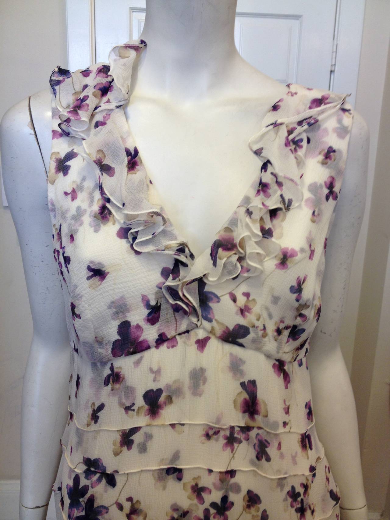 You will look like you're standing amidst a whirlwind of pansies in this romantic dress. The silk lining is covered with two layers of ultra-soft and delicate chiffon, both printed with hyper-realistic flowers in creamy purple. The effect is