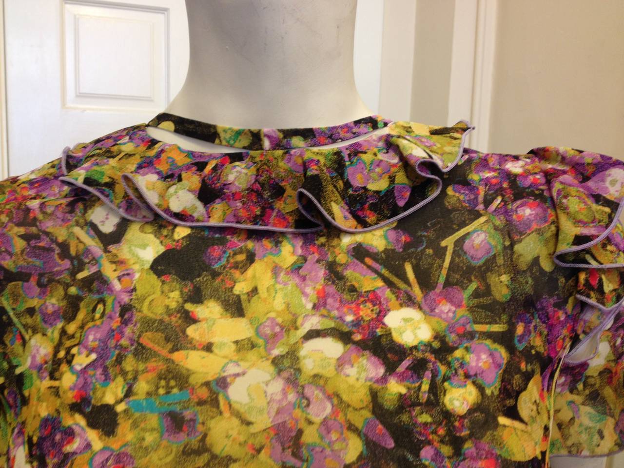 Spring florals never felt less predictable than with this piece - the designer takes the warm-weather staple and turns it on its head with an electric color scheme and a very abstracted print that almost looks more like an expressionist painting.