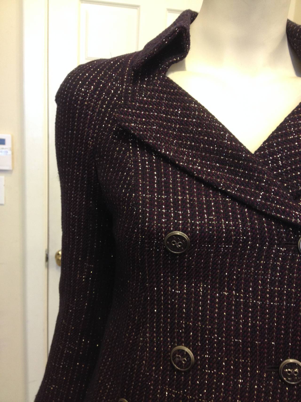 Such a deeply elegant piece - in a jewel-toned plum color woven throughout with navy and metallic gold threads, this jacket is perfect. The inky, saturated color is dressy and polished, while the cut is beautifully tailored and styled. The higher