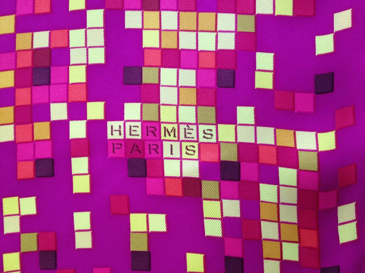 Such a beautiful constellation of colors. The Mosaique Au 24 scarf was designed by Benoit Pierre Emory for the spring 2008 collection, and also appears on much of the Hermes porcelain. The bright magenta and gold are perfect complements to each