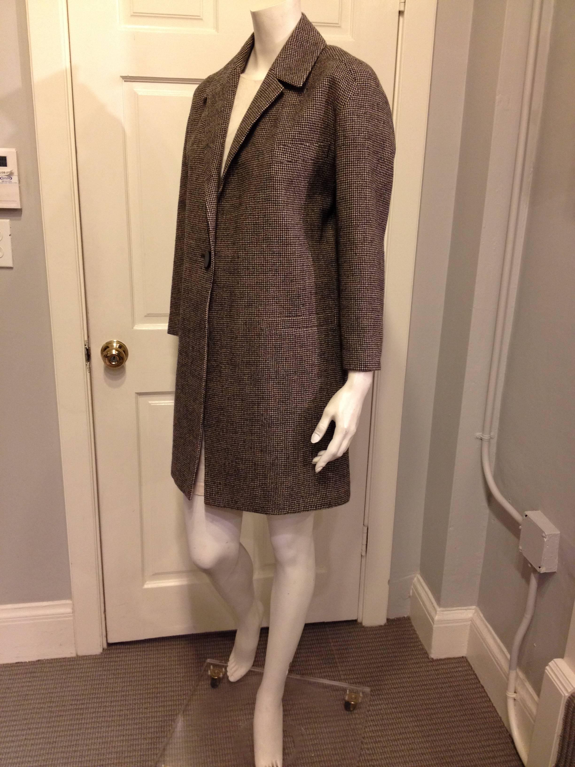 The classic 60s car coat is such an enduring and elegant style - cut wide with tailored shoulders and roomy sleeves, it's the perfect outer layer. The masculine suiting material is gorgeous, a small scale houndstooth of black on mushroom brown to