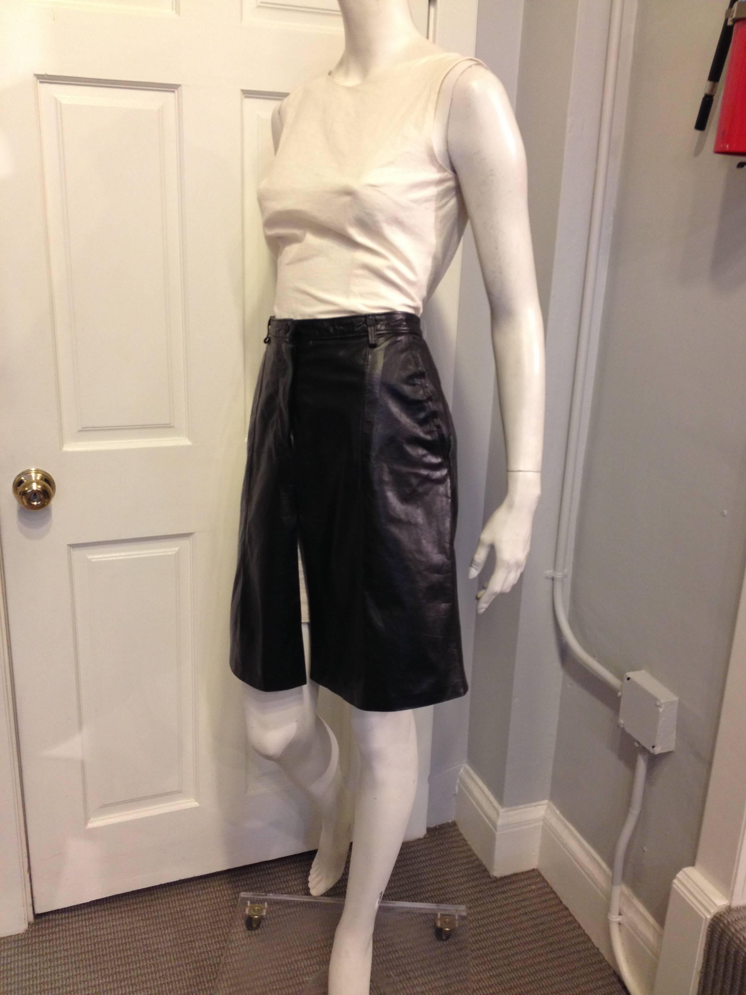 Tough, cool, and feminine all at once, this skirt by Ann Demeulemeester is effortless. The waistline sits high to accentuate the a-line silhouette, and the front is slit several inches high from the hemline. This piece is rock and roll and beautiful