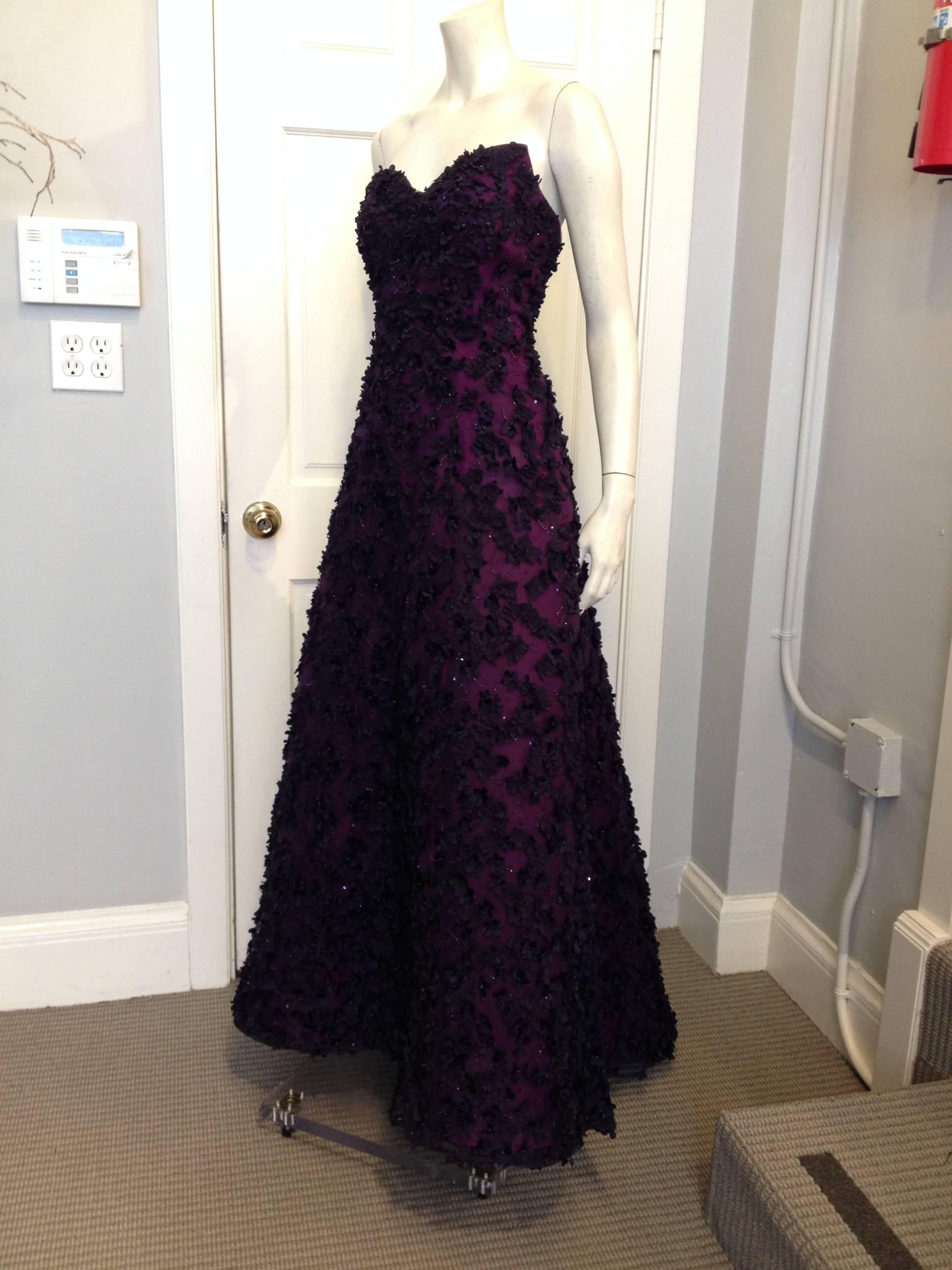 It's hard to overstate the magnificence of this gown! Royal purple lends a very grand and regal look. While the extremely intricate and exquisite embellishments that cover the gown make it feel sumptuous, it still stays young. An abundance of beaded