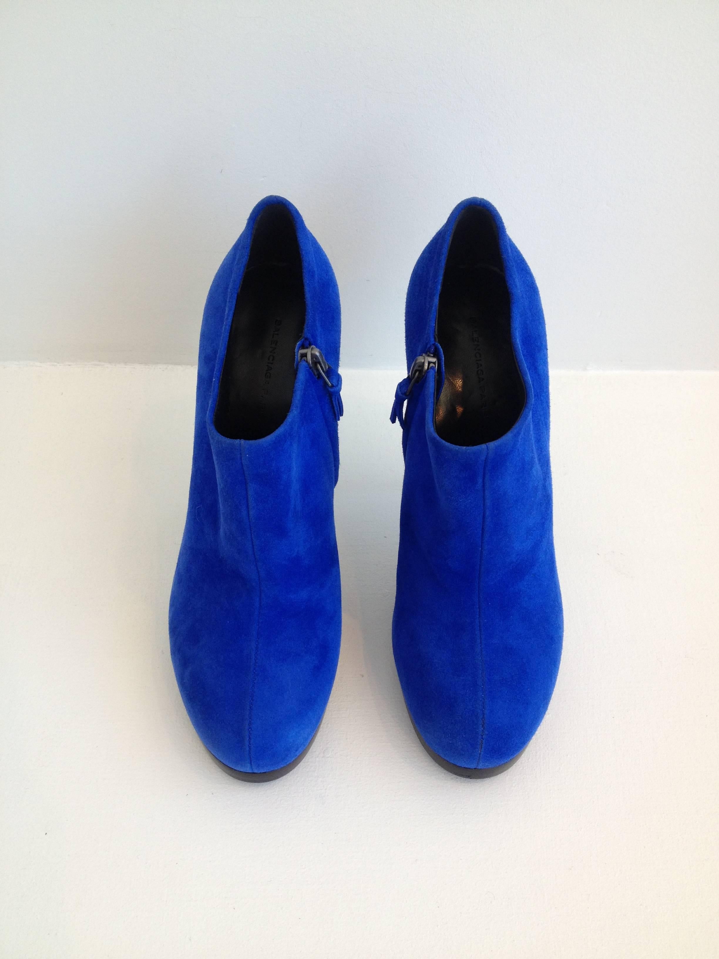 Bright and vibrant color is all you need to leap forward into spring. This pair by Balenciaga is fabulous - the exterior is made from a super saturated royal blue suede, perfect for adding a pop of color to any look. The 4.5 inch heel is covered