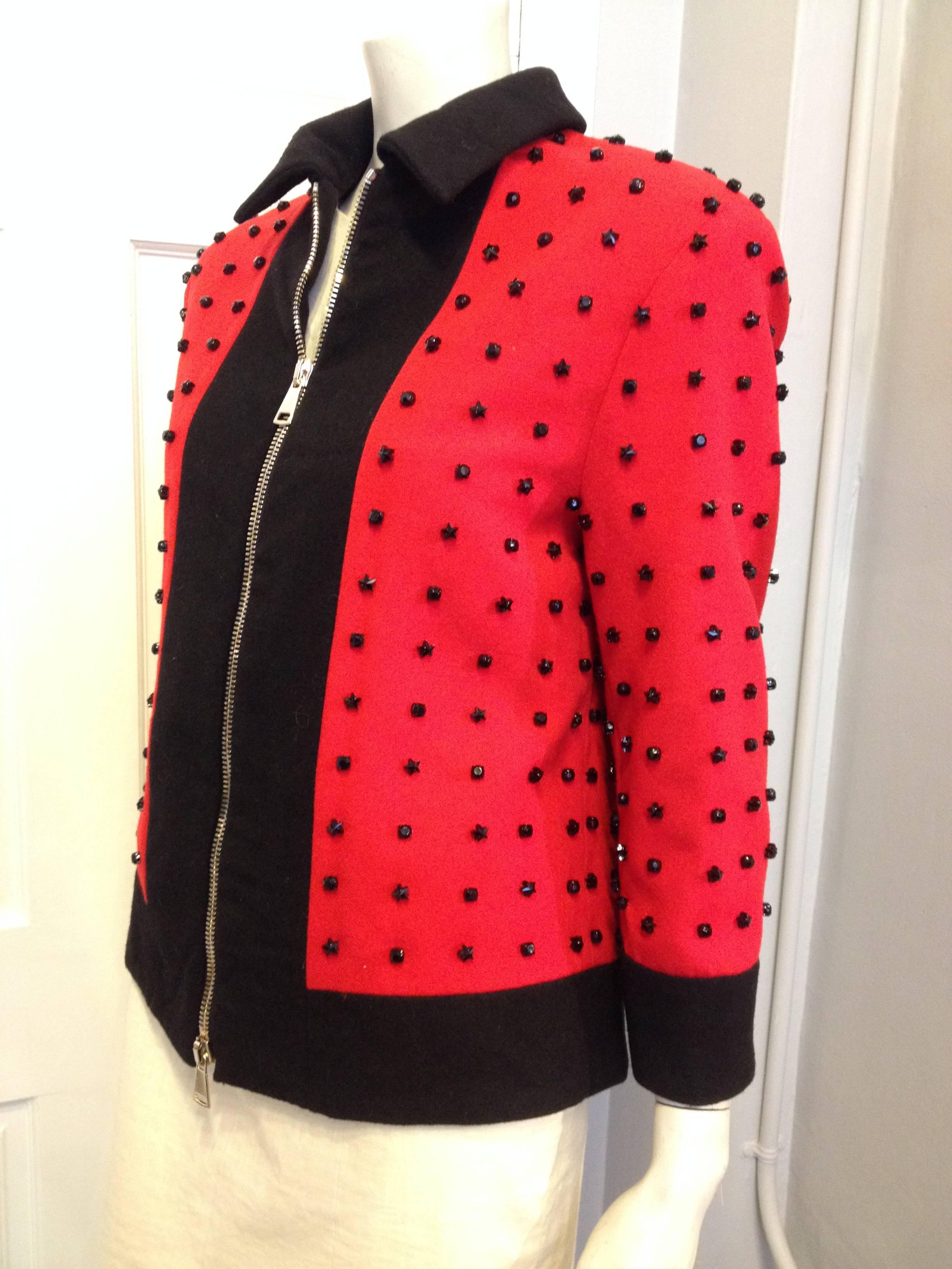 This Givenchy jacket has literal star power. A runway piece from the Autumn 2012-2013 menswear collection (look 39), it's so rock n roll - the bright red fabric is studded with a grid of three-dimensional prong-set star-shaped black rhinestones. The