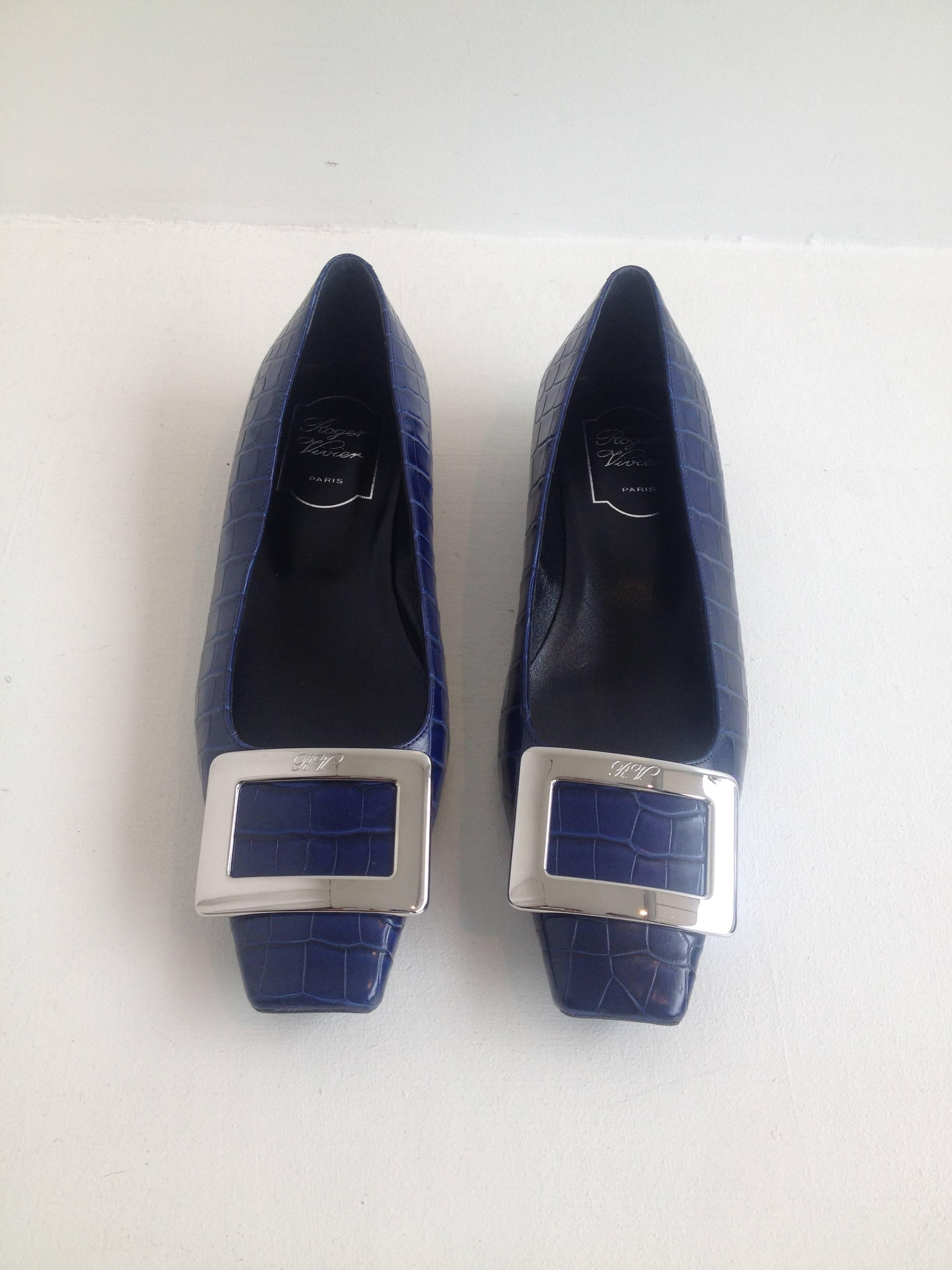 We love the way that even the most classic Roger Vivier flats always feel so current. These are timeless but simultaneously  edgy - the crocodile look is luxurious, while the eye-catching bright blue feels fresh and young. The square toe is totally