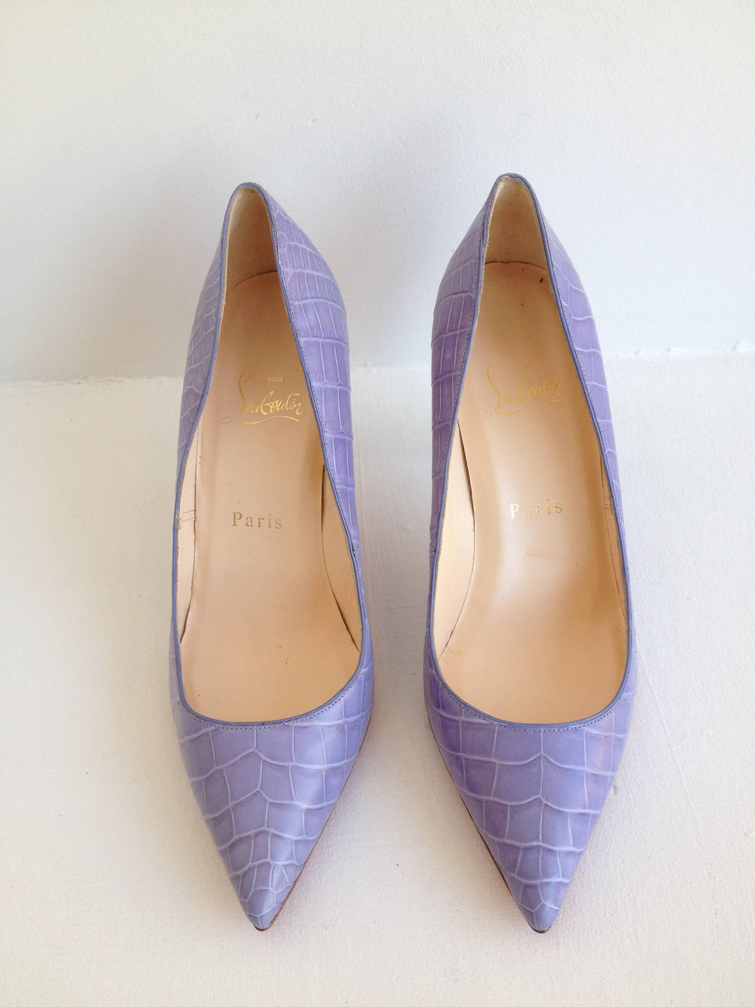 It's hard to think of a more perfect shoe than this one. Soft and sweet lavender contrasts with the classically luxurious crocodile skin, which is cut into a timelessly sleek silhouette with a pointed toe and sharp 3.5 inch stiletto heel. These are