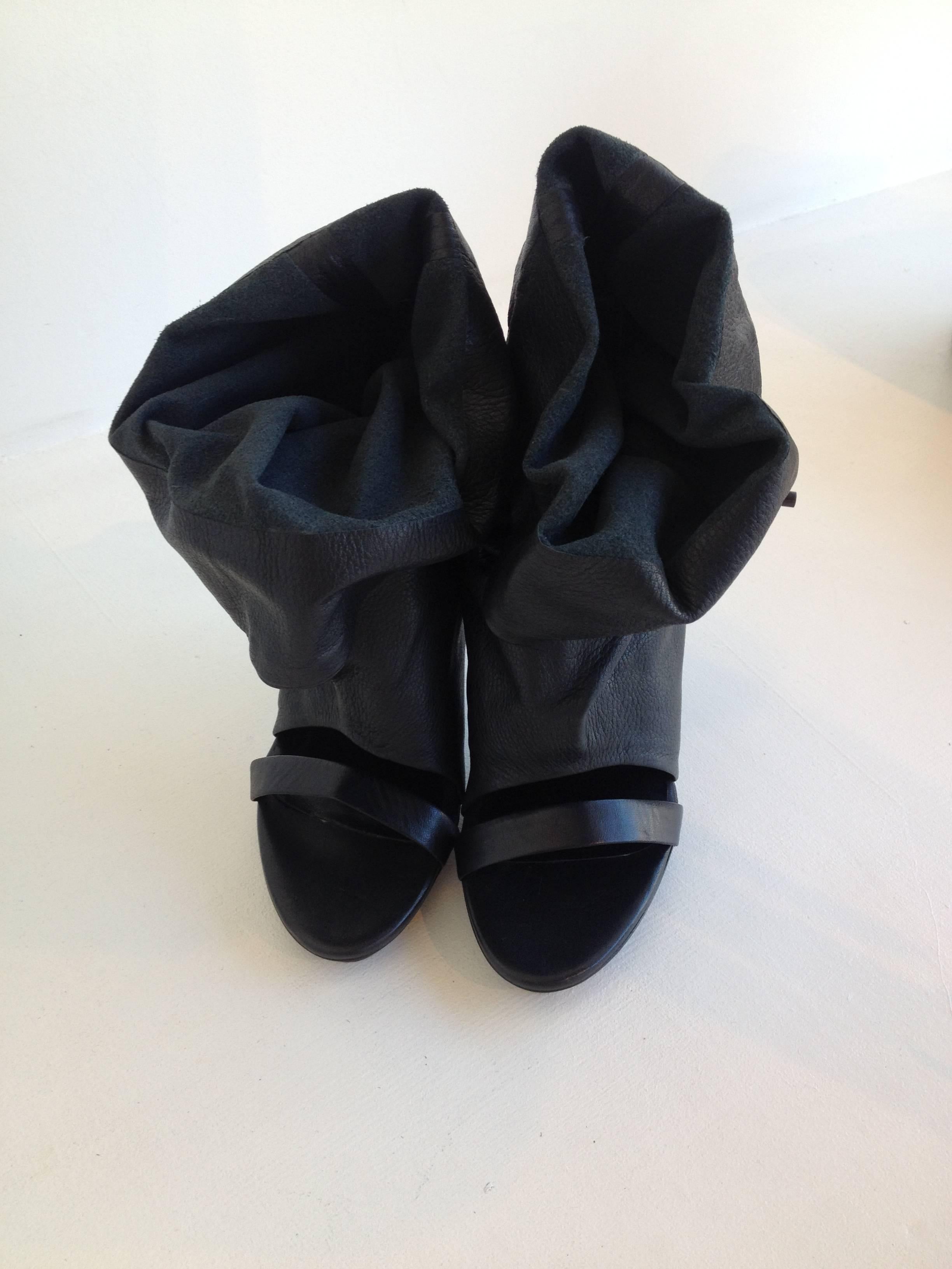 These black Balenciaga booties are a wearable work of art. The soft leather can be tied up or left down, making a statement any way you wear them. With a 4.25 inch heel that's high enough for a night out, and comfortable to walk around in, these are