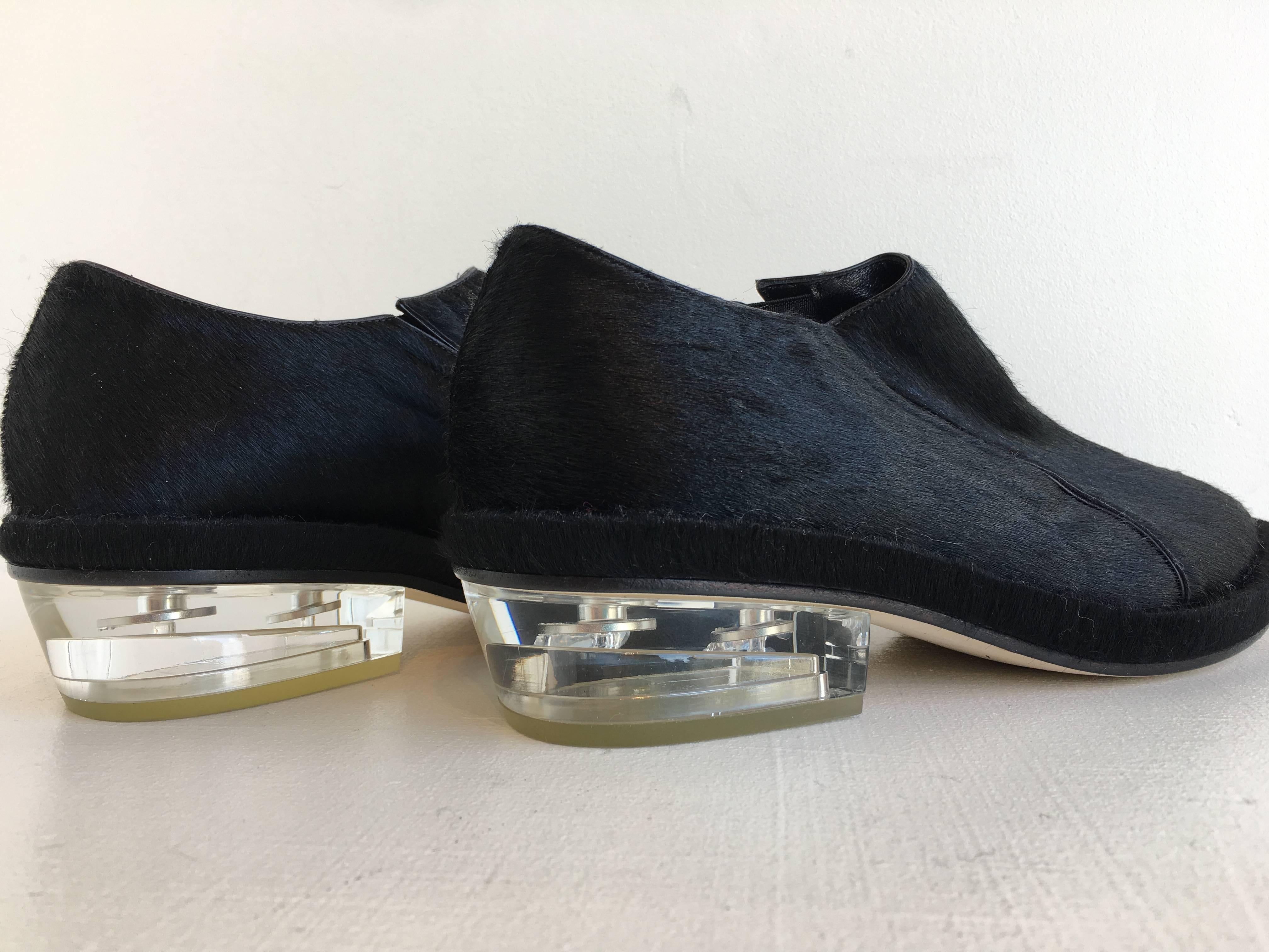 Simone Rocha black pointy toe pony-hair shoes with clear 1.5 inch resin heel.