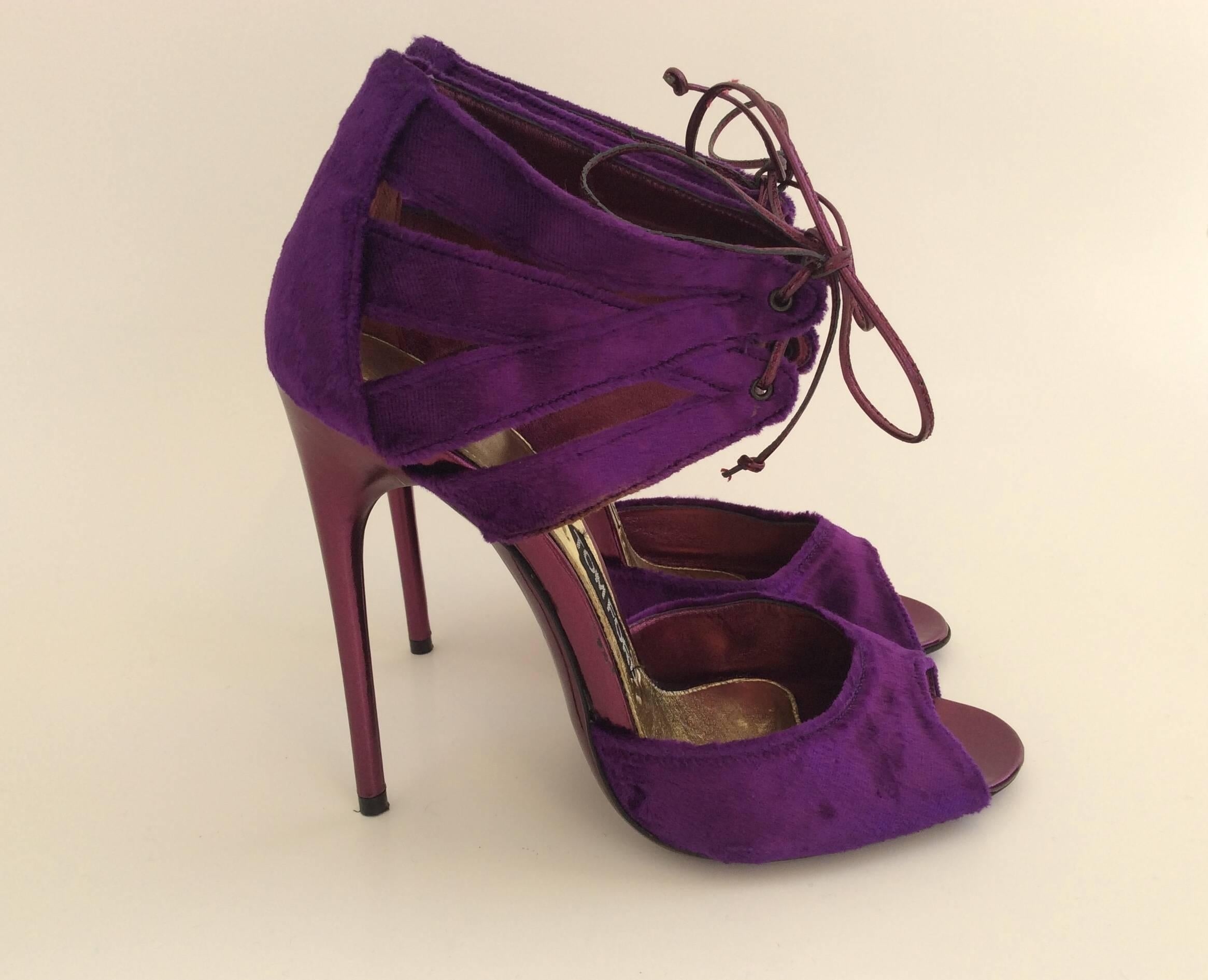 Tom Ford vibrant violet velvet evening sandals. The 5in stiletto heel is covered in metallic magenta leather matching the ties and the soles.
