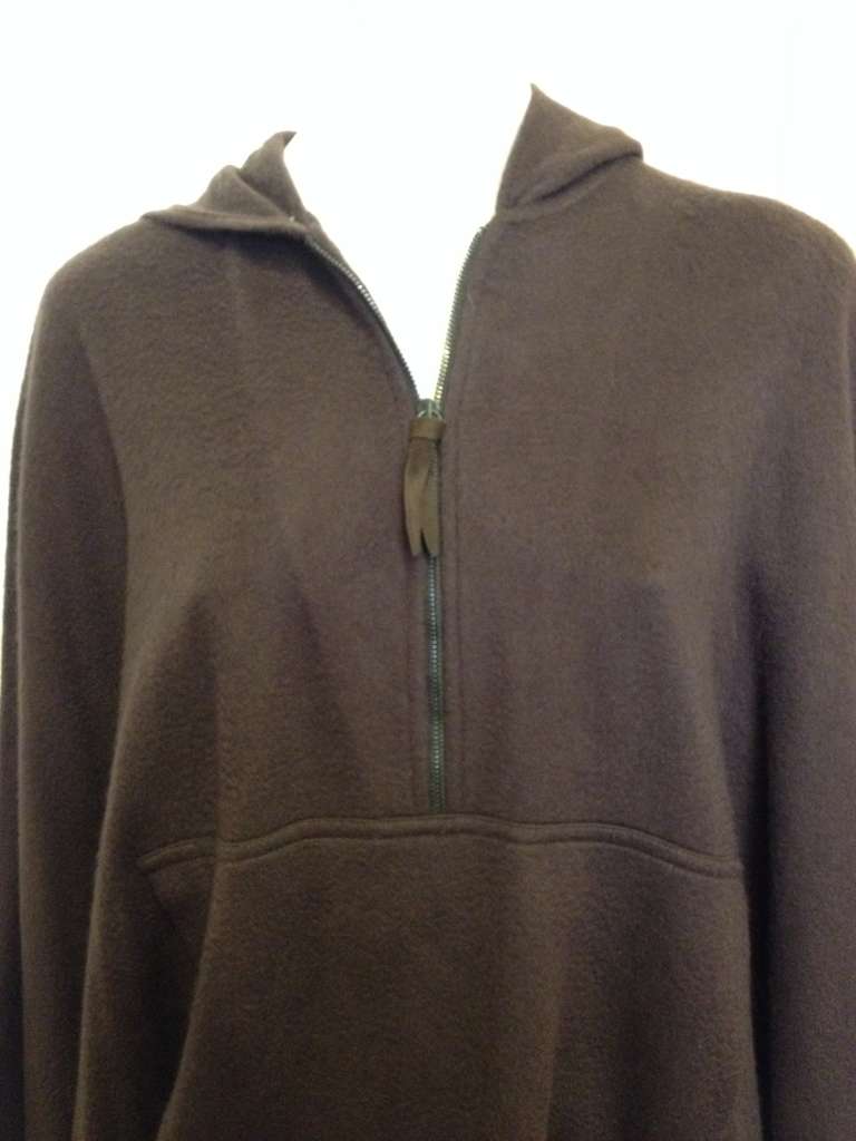 Stay warm in this hooded Loro Piana poncho! With a generously draping cut and an oversized hood, it is perfect for throwing on for some effortless elegance and comfort. Wear with black tights and heels or with a pencil skirt - the gorgeous quality
