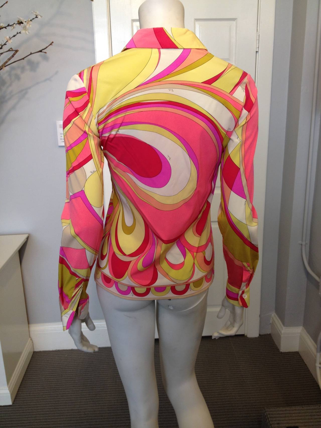 Jump into summer! Hot pink, coral, vibrant spring green, chartreuse, and white are combined in this iconic print. Pucci always adds a shot of exuberance in his eye-catching color combinations and this one is perfect for the warm, sunny months ahead!
