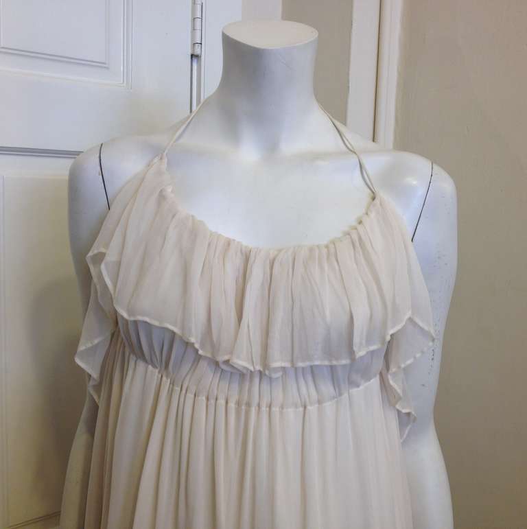 This dress was made to wear while you run through a field of daisies in the summer! Perfect for those long hot days spent swimming and having brunch, this dress is easy, feminine, and gorgeous. The fluttery panel on the bust and empire waistline add
