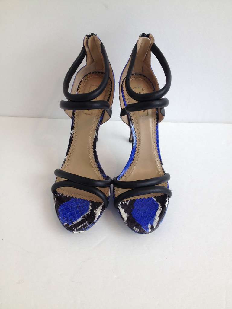 With a towering 5 inch stiletto heel and a snakeskin print in vibrant blue, these sandal heels by Aquazzura are a bold and fun statement shoe. The relatively new company (founded in 2011) has made a name for itself with their collections of