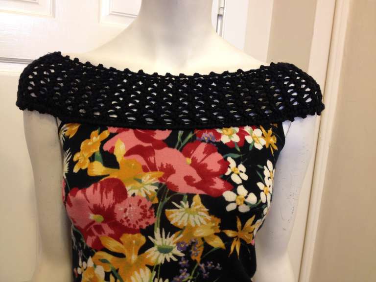 This gorgeous top features a bouquet of flowers for a fresh summertime feel.  The lightweight knit is perfect for warm weather, but could easily be worn under a cardigan or jacket in the fall and winter.  The crocheted neckline gives this top a