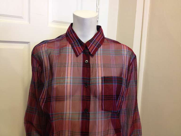A feminine twist on the classic plaid flannel.  This shirt is made of silk chiffon and has a deep red color with lavender and blue stripes.  Wear over a camisole and leggings, or with a lacy bra for a sexier style.
