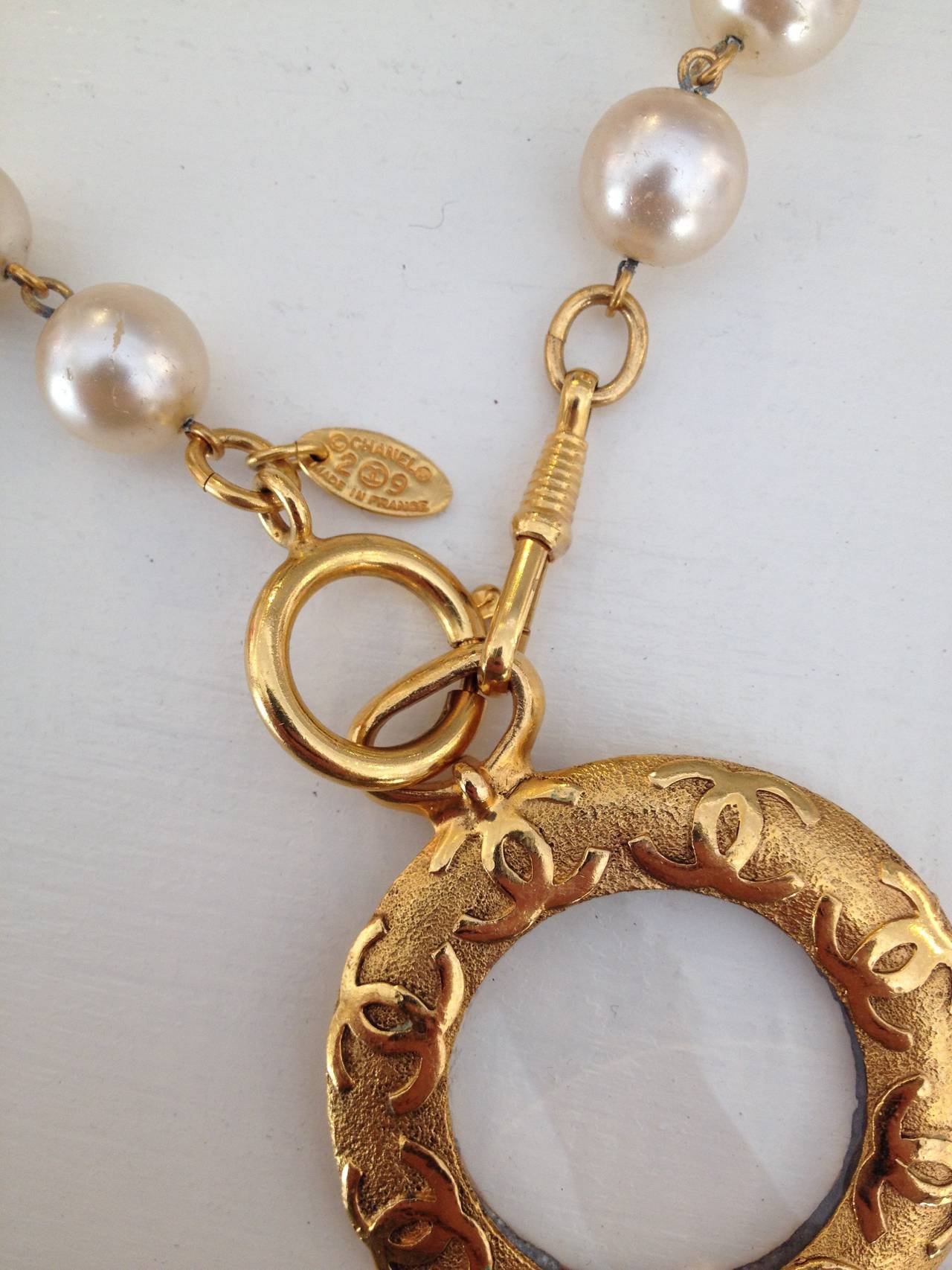 Chanel Pearl Necklace with Gold Tone Magnifying Glass Pendant In Good Condition In San Francisco, CA