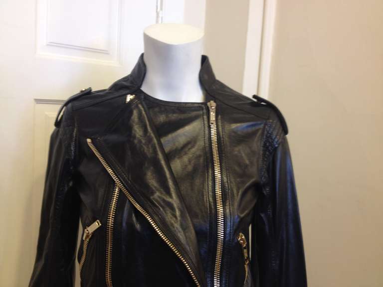 This leather jacket from British designer Matthew Williamson is a great piece - the super soft leather and heavy gold hardware create a look that is timeless, tough, and sleek all at once. The unique doubled zip-on front panel adds a unique and new