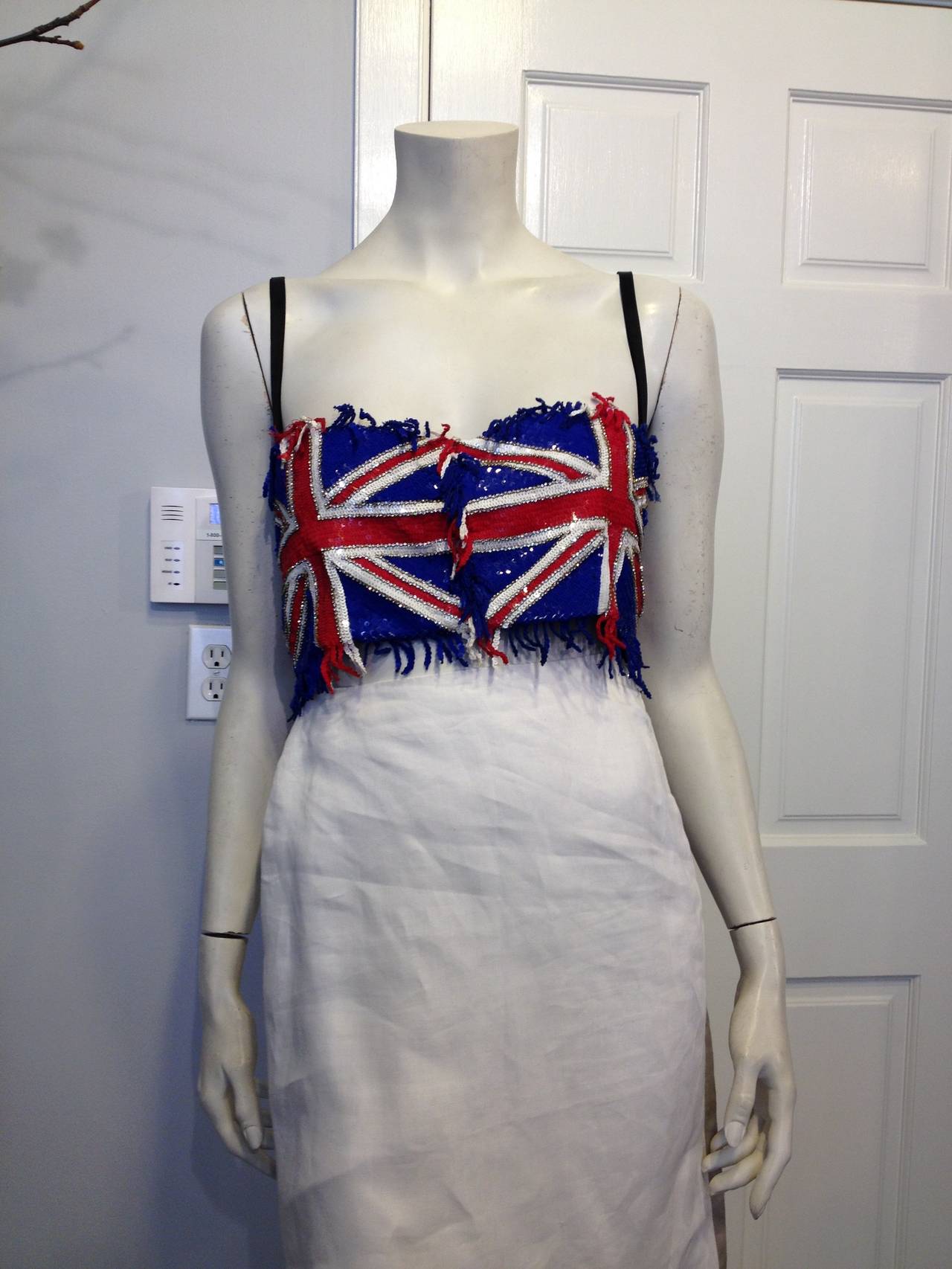 Declare your allegiance to the flag! This Dolce & Gabbana bustier is the perfect way to show your true colors. The Union Jack is resplendent in red, white, and blue sequins, accented with little rows of rhinestones. The interior is lined with a bra