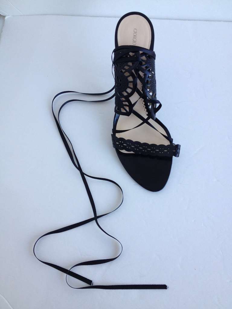 These Giorgio Armani heels are incredible! The lace-like panels on either side of the heel and the strap across the toes are made from laser-cut leather, which creates a gorgeous and delicate pattern when worn. The lace-up ribbons add to the lattice