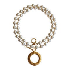 Chanel Pearl Necklace with Gold Tone Magnifying Glass Pendant