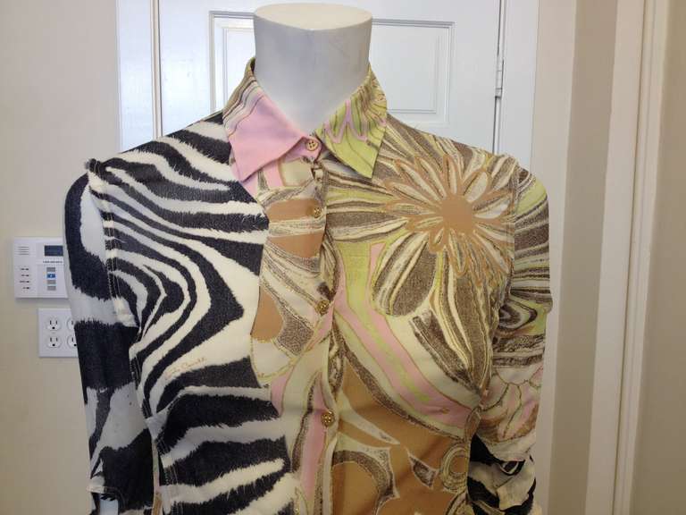 Take a walk on the wild side with this gorgeous melange of colors and patterns.  Pastel pinks and greens swirled with beige and tan for a feminine and earthy color palette.  The arms finish with an open sleeve that is woven together with a strip of