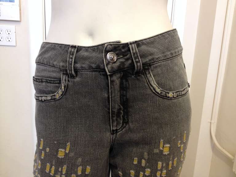 These gray jeans are distressed with style!  Small rips allow yellow thread to show between the frayed edges for a fun and unique look.  A small black CC logo is embroidered on the back right pocket.  These jeans are the perfect combination of edgy