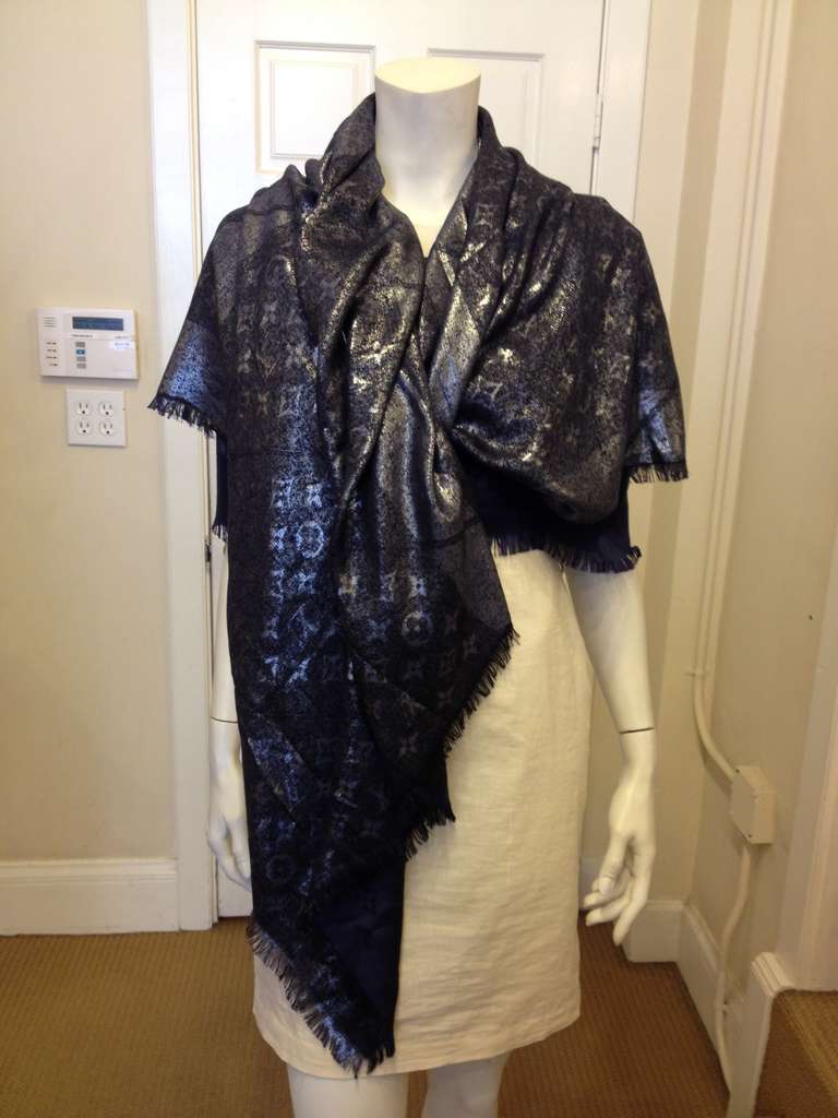 Every woman needs a luxurious shawl to wrap around herself--and this beautiful silk/wool blend is just the ticket.  Choose to show off the monochromatic blue or shimmering silver side.  Perfect to take for extra warmth when you travel, or to keep