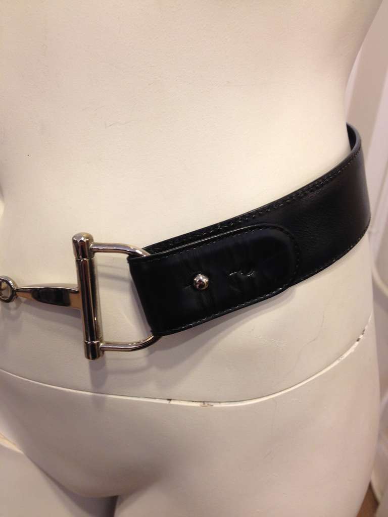Drape this beautiful black leather belt around your waist. The bright silver horsebit is iconic and simple - perfect for slinging over a simple black sheath dress. The Gucci aesthetic has always had a streak of equestrian glamor, epitomized by both